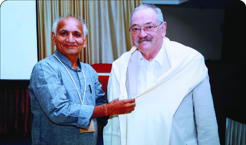 Prof V K Rastogi (left) honoring well-known Raman Spectroscopist Prof Wolfgang Kiefer (right) by presenting shawl on October 6, 2017 during ICSBAM-2017, Hotel Haweli, Alappuzha, jointly Organized by Christian College, Chengannur and Indian Spectroscopy Society, Ghaziabad, India.